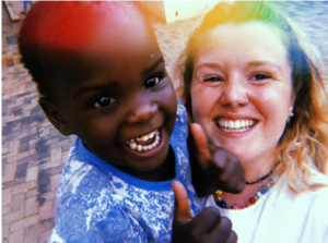 Sorcha Dempsey-Roberts and one of the children in the Sandra Jones Centre, Zimbabwe, July 2019